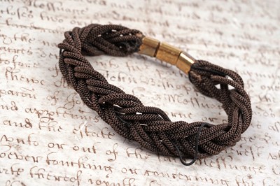 Lot 102 - A 19th Century hairwork mourning bracelet, dated 1866