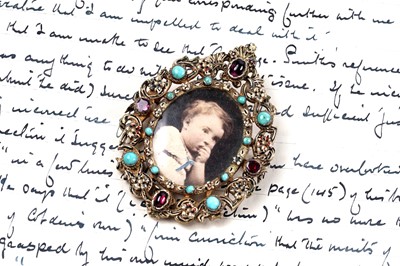 Lot 105 - A late 19th Century Hungarian silver-gilt jewel with photograph compartment
