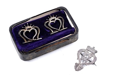 Lot 225 - A Victorian silver luckenbooth brooch; and a pair of Hamilton and Inches menu holders