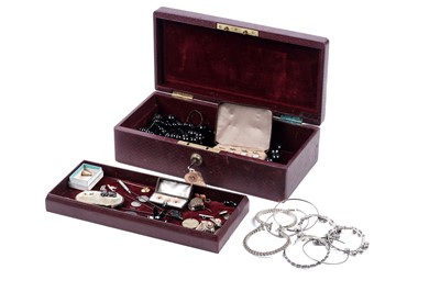 Lot 107 - A 19th Century oxblood leather jewellery box containing assorted jewellery and decorative items
