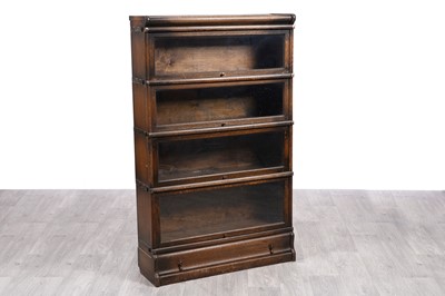 Lot 2 - An oak sectional bookcase