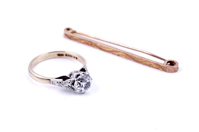 Lot 138 - A 1930s 9ct rose gold tie pin, with engraved message; and a 1960s white zircon ring