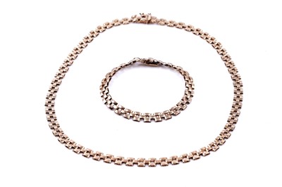 Lot 127 - A 20th Century modern 9ct gold brick-link bracelet and necklace set