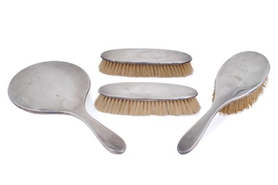 Lot 201 - A 1920s Art Deco silver mirror and brush set