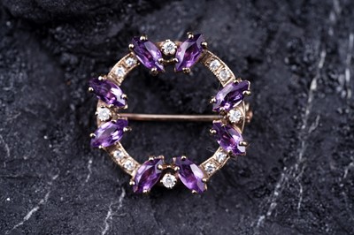 Lot 5 - A 20th Century modern amethyst and diamond wreath pattern brooch