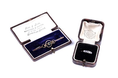 Lot 12 - An early 20th Century peridot and 9ct gold bar brooch; and a five stone spinel ring