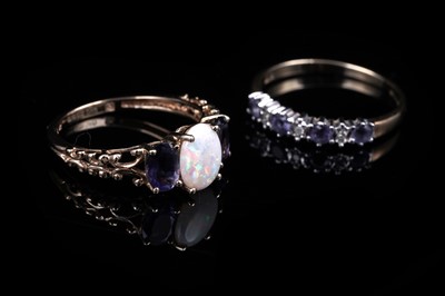 Lot 40 - An opal and tanzanite ring; and a tanzanite and diamond half hoop ring