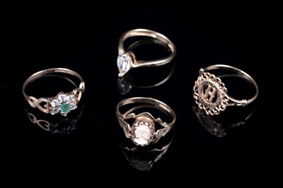 Lot 55 - Four gold rings, including: a 14ct gold cubic zirconia pear cut solitaire