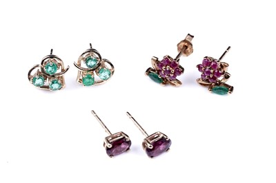 Lot 60 - Modern ruby and emerald stud earrings; and a pair of pink tourmaline stud earrings