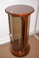 Lot 720 - A modern mahogany circular display cabinet...